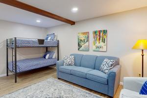 a living room with a couch and a bunk bed at Liftside Retreat in McHenry +43 photos