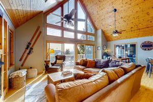 a large living room with a couch and a table at Bear's Eye View in McHenry