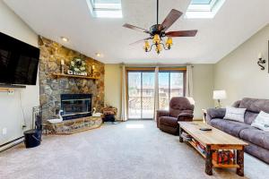 a living room with a couch and a fireplace at Oakland Oasis in Oakland +17 photos