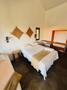 a hotel room with two beds and a window at Maré de Atins Eco Lodge in Atins +48 photos