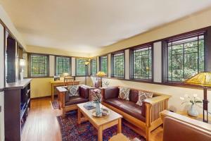 a living room with a couch and a table at The Frank Lloyd Wright Home @ Deep Creek, MD in Bittinger