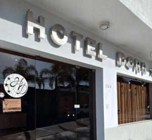 a store front with a hilus sign on the facade at Hotel Dora in Termas de Río Hondo