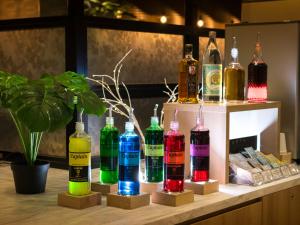 a display of different colored bottles on a table at Super Hotel Asakusa in Tokyo