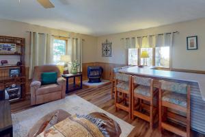 a living room with a bar and a table at Life's A Bear in McHenry