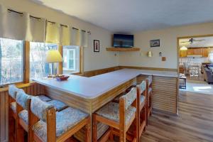 a kitchen with a large table and chairs at Life's A Bear in McHenry