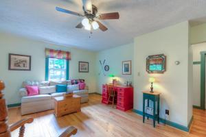 a living room with a couch and a ceiling fan at Amazing Grace in McHenry
