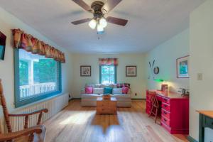 a living room with a couch and a ceiling fan at Amazing Grace in McHenry