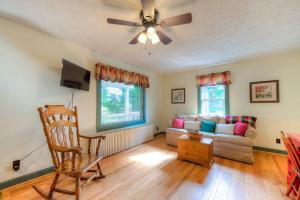 a living room with a couch and a ceiling fan at Amazing Grace in McHenry +42 photos