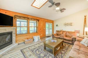 a living room with a couch and a fireplace at Gleanings Pond in McHenry
