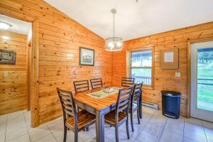 a dining room with a table and chairs at Gleanings Pond in McHenry