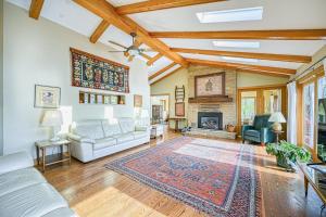a living room with a couch and a fireplace at A Million Dollar View in Oakland