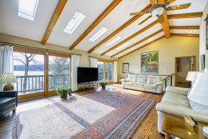 a living room with a couch and a tv at A Million Dollar View in Oakland