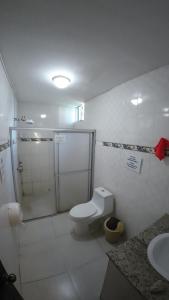 a bathroom with a shower and a toilet and a sink at Cataleya BDT in Bocas Town +34 photos