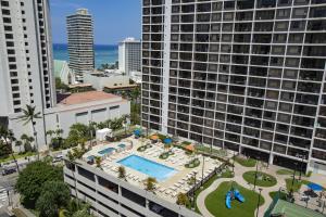 an aerial view of a large apartment building with a pool at Aston at the Waikiki Banyan in Honolulu