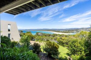 a view of a beach from a house at Bula Vista in Merimbula