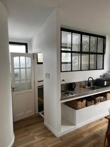 a kitchen with a sink and a counter top at La Vicenta in Jesús María +1 photo
