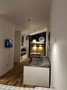 a living room with a table and a kitchen at La Vicenta in Jesús María