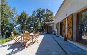 a patio with a table and chairs on a building at Sa Talaia in Lluc +11 photos