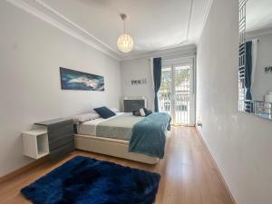 a bedroom with a bed and a blue rug at Sunset Marbella in Marbella +61 photos