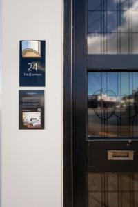 a door with a sign on it with a window at The Advocate in Martinborough