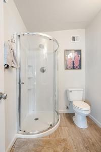 a bathroom with a shower and a toilet at Oasi Elegante in Scottsdale +59 photos