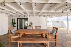 a wooden table and chairs on a patio at Oasi Elegante in Scottsdale