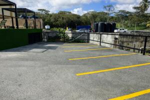 a parking lot with yellow lines on the ground at The Hive Boutique Hotel Pool Suite 108 in Scarborough