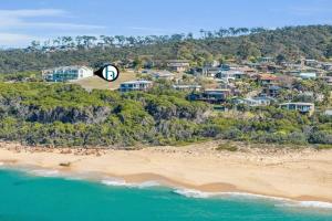 an aerial view of a beach with houses at Quarterdeck 6 in Tura Beach