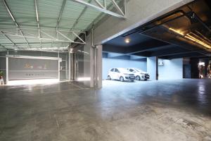 a garage with a white car parked in it at Iksan 4 Seasons Hotel in Iksan