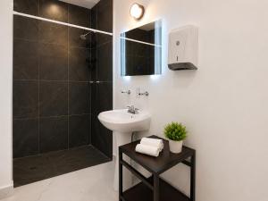 a white bathroom with a sink and a shower at Hotel Boutique Venecia Cdmx in Mexico City +55 photos
