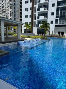a large swimming pool in the middle of a building at Spacious 2beds 1bedroom in Punta Engaño