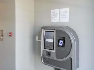 a large gray machine in a hospital room at Ibis Budget La Rochelle Puilboreau in Puilboreau