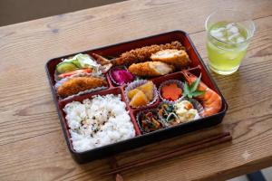 a tray of food on a table with a drink at SEN RETREAT TAKIJIRI - Kumano Kodo Gateway in Tanabe +46 photos