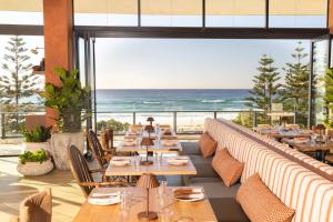 a restaurant with a view of the beach at Peppers Soul Surfers Paradise in Gold Coast