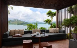 a living room with a couch and a table at The Lalu Sun Moon Lake in Yuchi