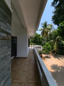 a hallway of a building with a view of a beach at Ram's Heaven in Guruvāyūr