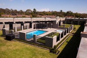 an aerial view of a house with a swimming pool at Southgate in Shepparton