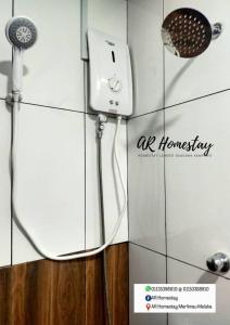 a box with an air humidityimeter and a microphone at Ar Homestay Merlimau in Merlimau +9 photos