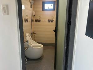 a bathroom with a tub and a toilet in it at Villa Đại Dương 2 View biển in Cu Lao Thu +68 photos