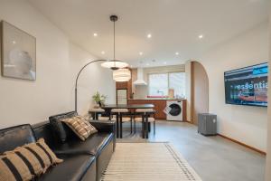 a living room with a couch and a table at Nakwon Stay 3-Min Walk to Anguk & Jongno 3-ga Stations in Seoul