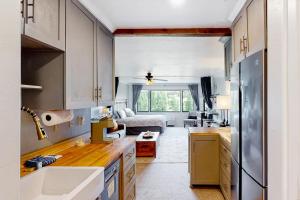 a kitchen and living room with a couch at The Lodge at Tamarron #425 in Durango