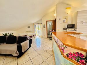 a living room with a couch and a table at Grandmother's Attic in Furore +17 photos