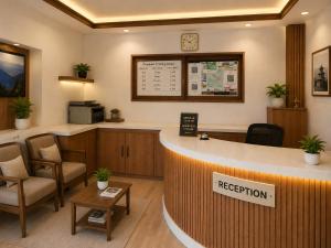 a waiting room with a reception counter and chairs at Dhulikhel Training center in Dhulikhel