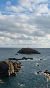 an island in the middle of the ocean at 金木犀 in Kesennuma