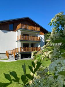 a house with wooden balconies on a hill at Willa Torfowa in Wisła
