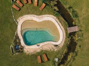 an aerial view of a swimming pool in the grass at Villa Vadori Suites in Falda del Carmen