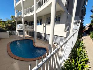 a house with a swimming pool in front of it at Jubilee Apartment 04 - Bring your own linen in South West Rocks