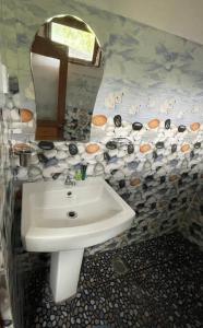a bathroom with a sink and a mirror at Archwey Coco Ella in Ella +97 photos
