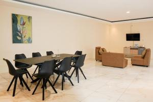 a dining room with a table and chairs at Nimo Resort Ciater in Ciater