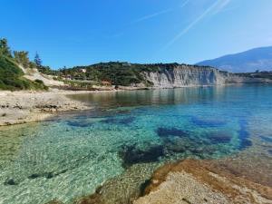a view of a body of water with a beach at Klimatsias Beach Apartment in Pesádha